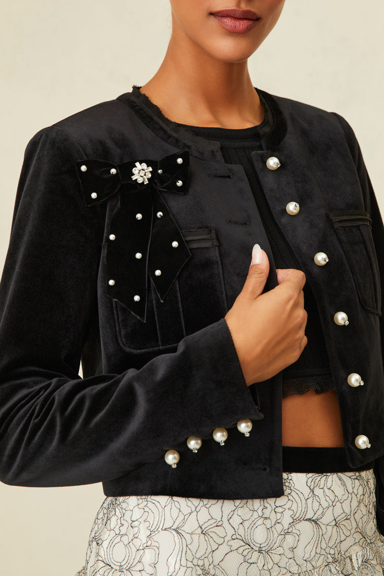 Luxe velvet cropped jacket that features pearl buttons with crystal embellishments.