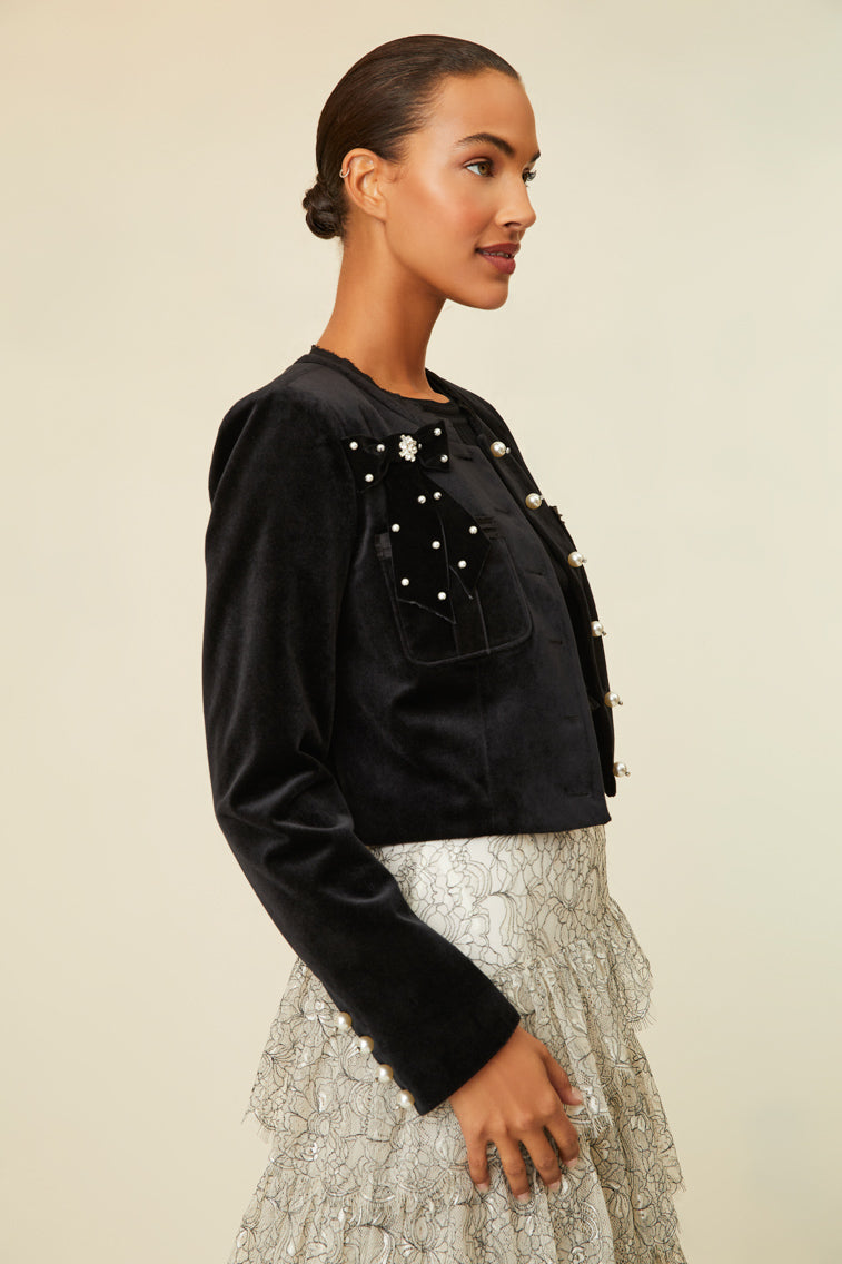 Luxe velvet cropped jacket that features pearl buttons with crystal embellishments.