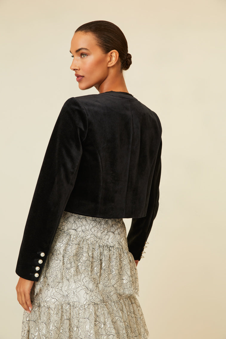 Luxe velvet cropped jacket that features pearl buttons with crystal embellishments.