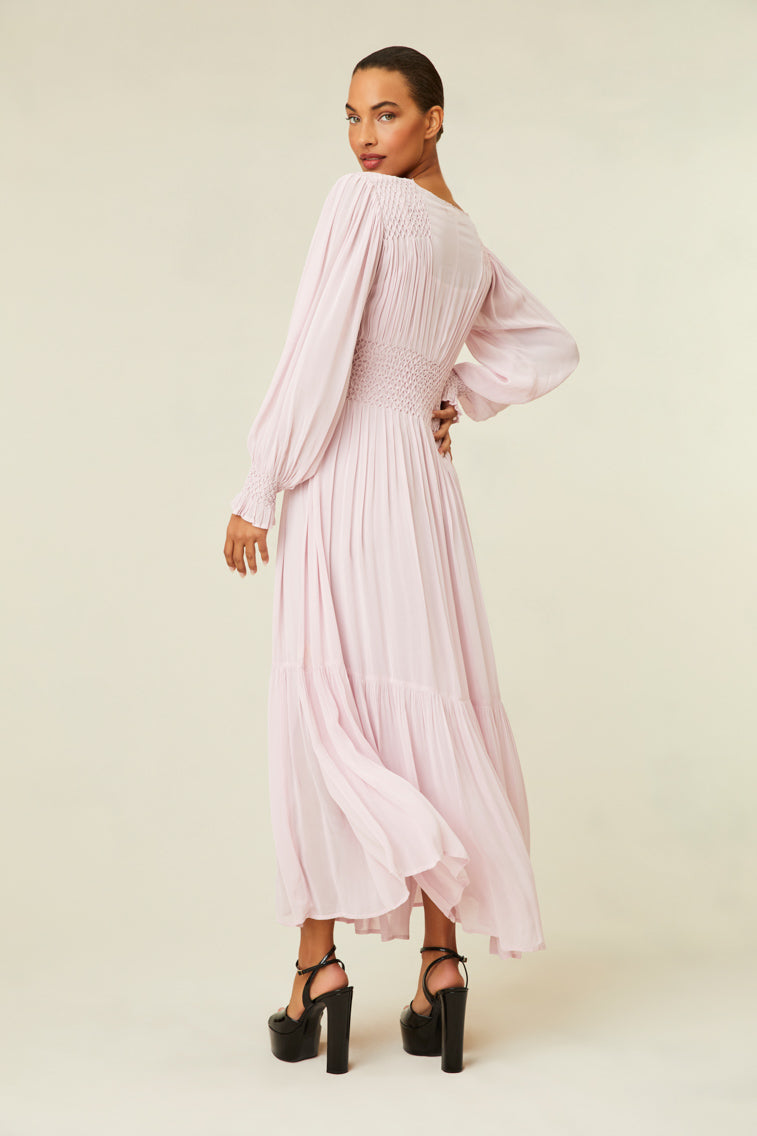 Maxi dress features diamond smocking at the bodice and shoulder.