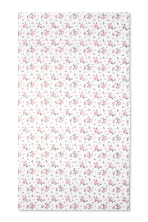 vintage-inspired repeating floral print bath towel in a soft pink against a white back
