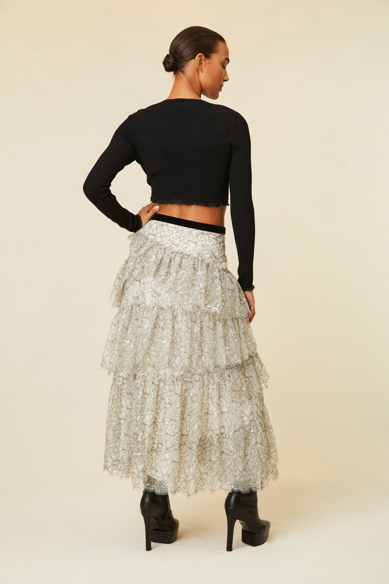 Midi skirt features multi-tiered layers of delicate French lace and a velvet tape ribbon.