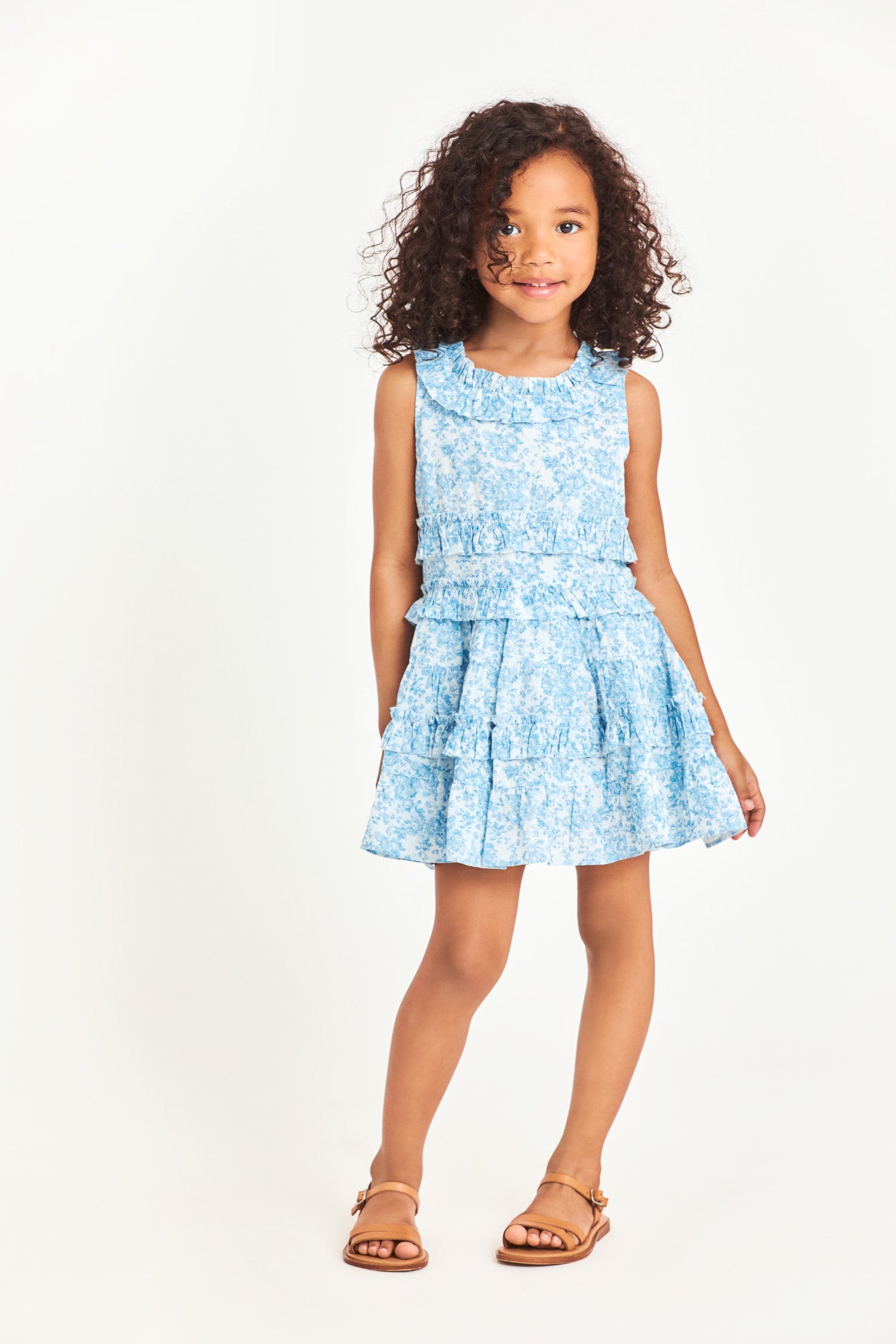 Model wearing kids blue sleeveless mini dress