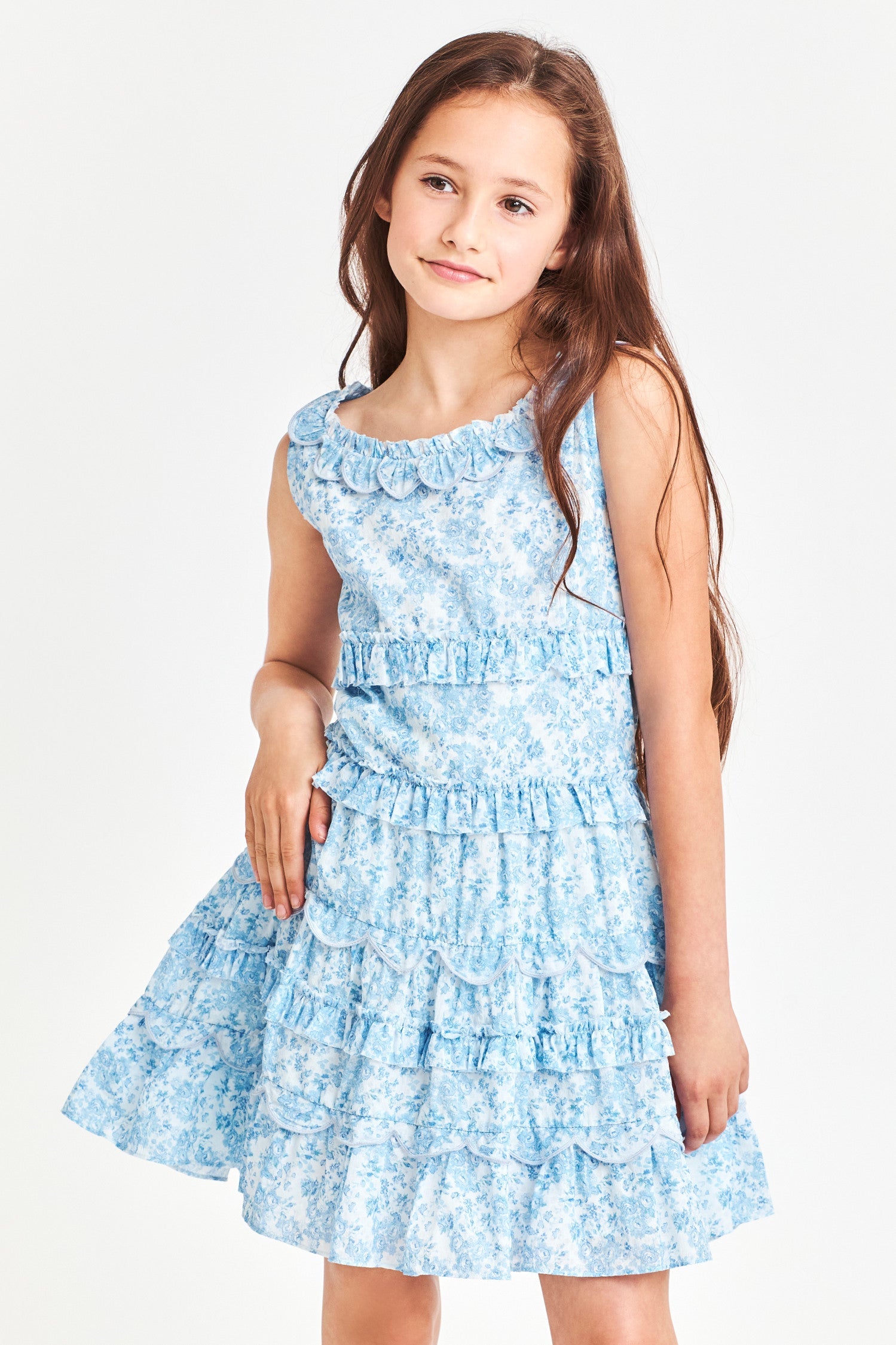 Model wearing kids blue sleeveless mini dress