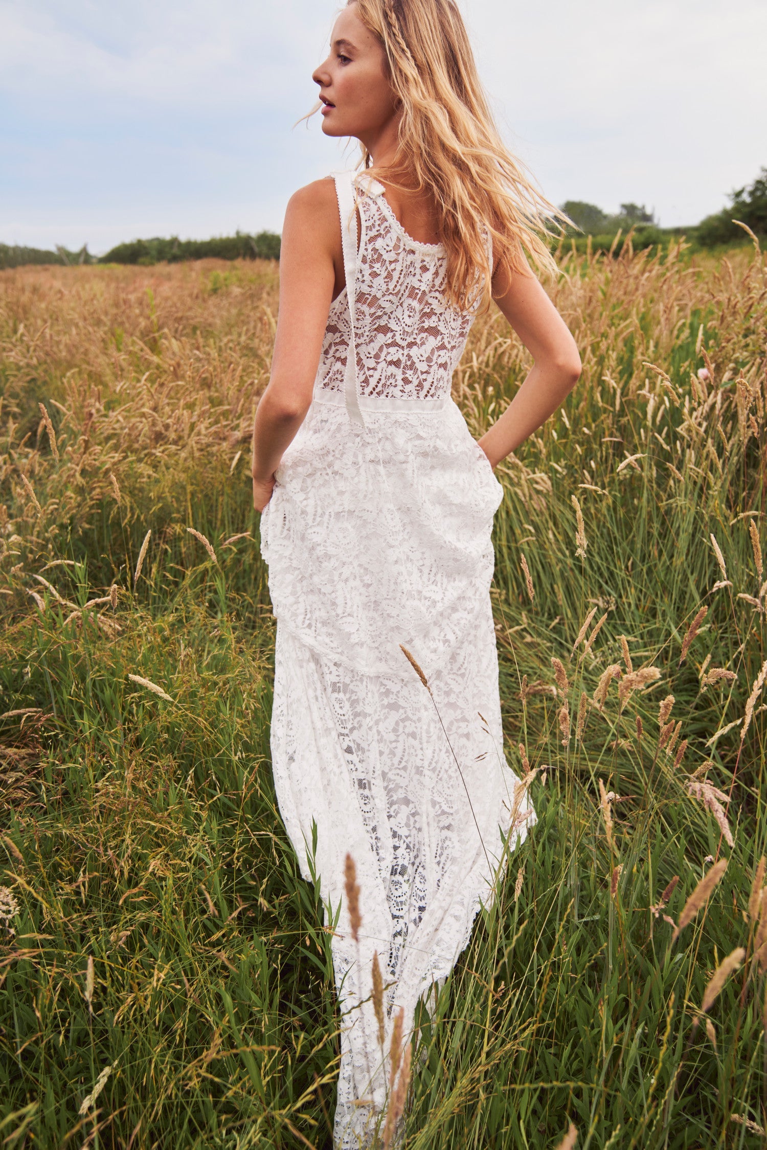 Women's white bridal gown with floral lace