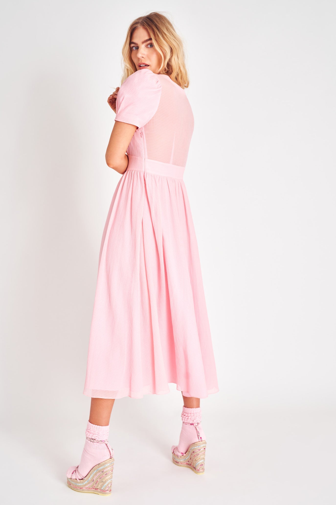 Powder Pink puff sleeve v neck midi dress with fitted waist.