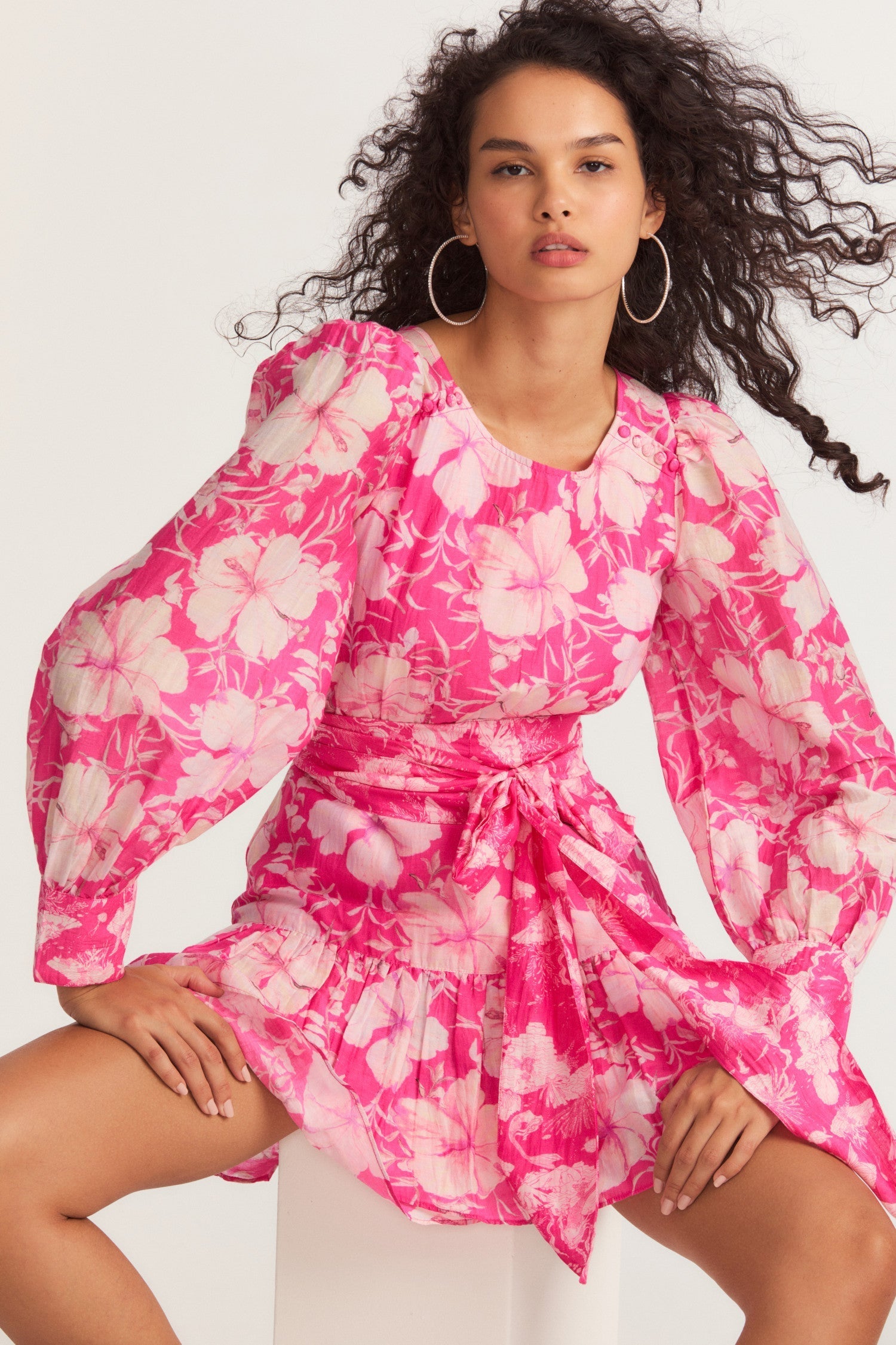 Womens pink floral mini dress with flounce sleeves and sash detail. 