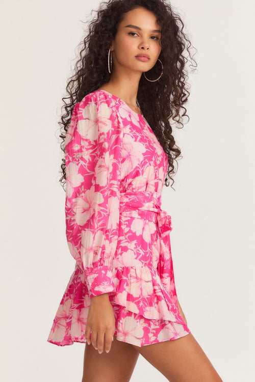Womens pink floral mini dress with flounce sleeves and sash detail.