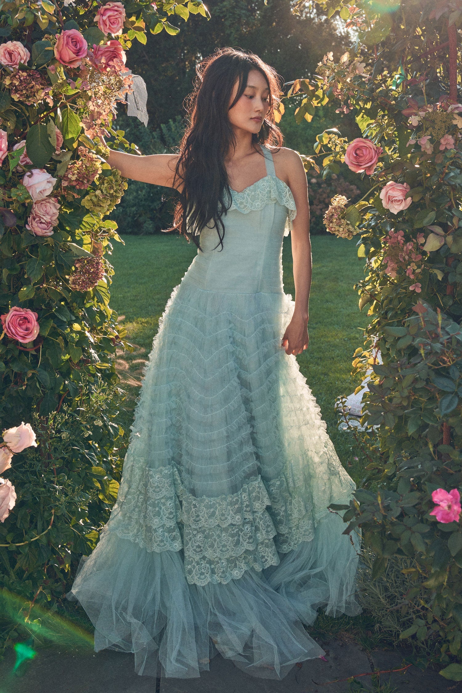 Women's blue tulle gown with pleated detailing