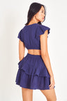 Short sleeve dress with cutouts and a ruffle mini skirt.