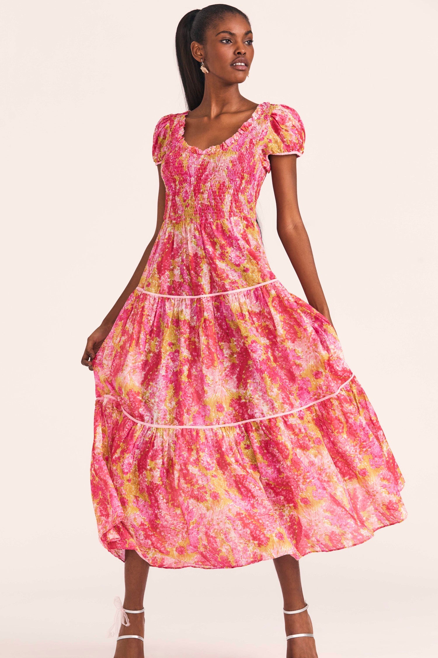 Women's pink and coral cotton-silk blend dress with a hand-painted impressionistic watercolor print and contrast piping.