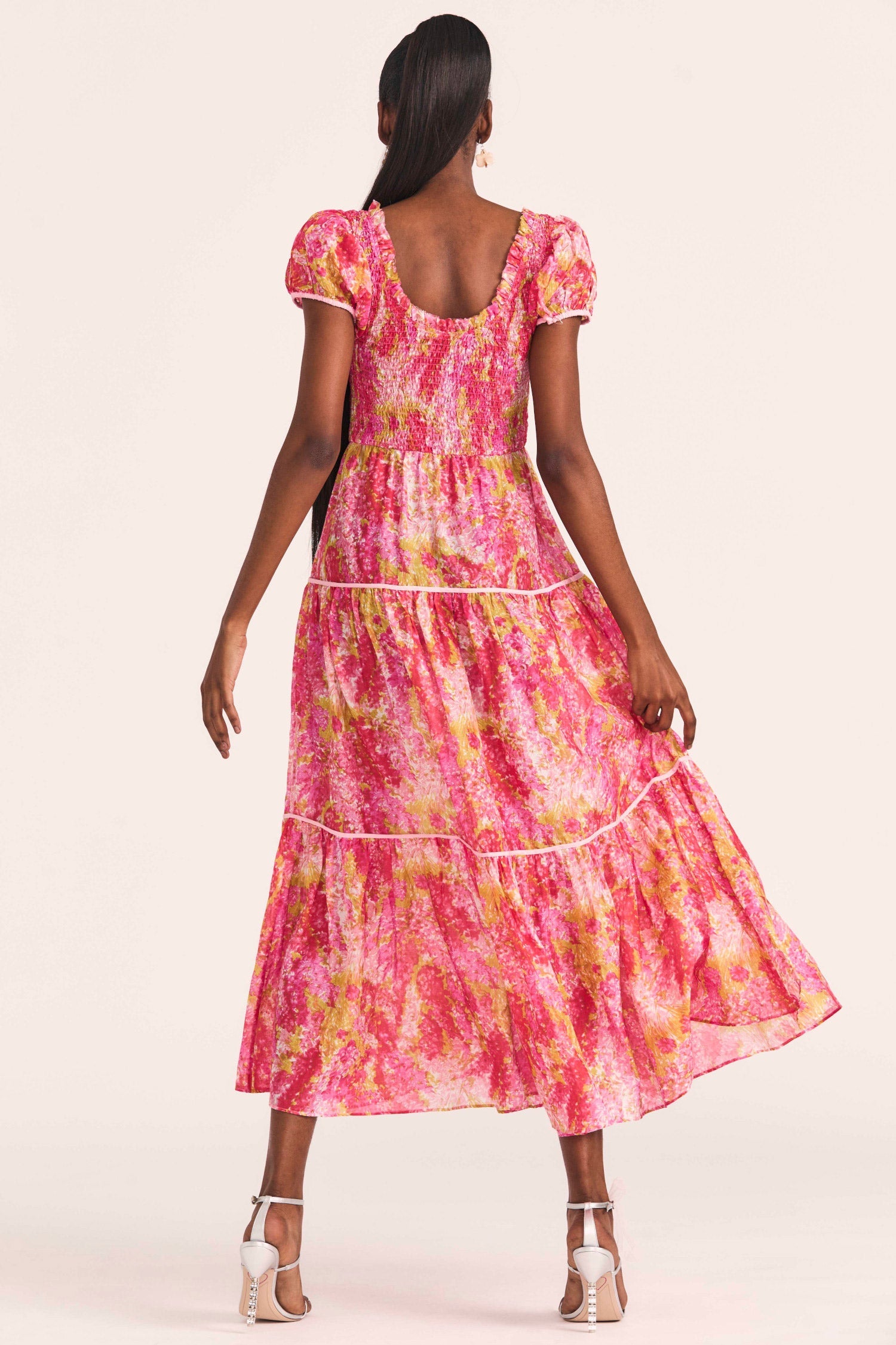 Women's pink and coral cotton-silk blend dress with a hand-painted impressionistic watercolor print and contrast piping.