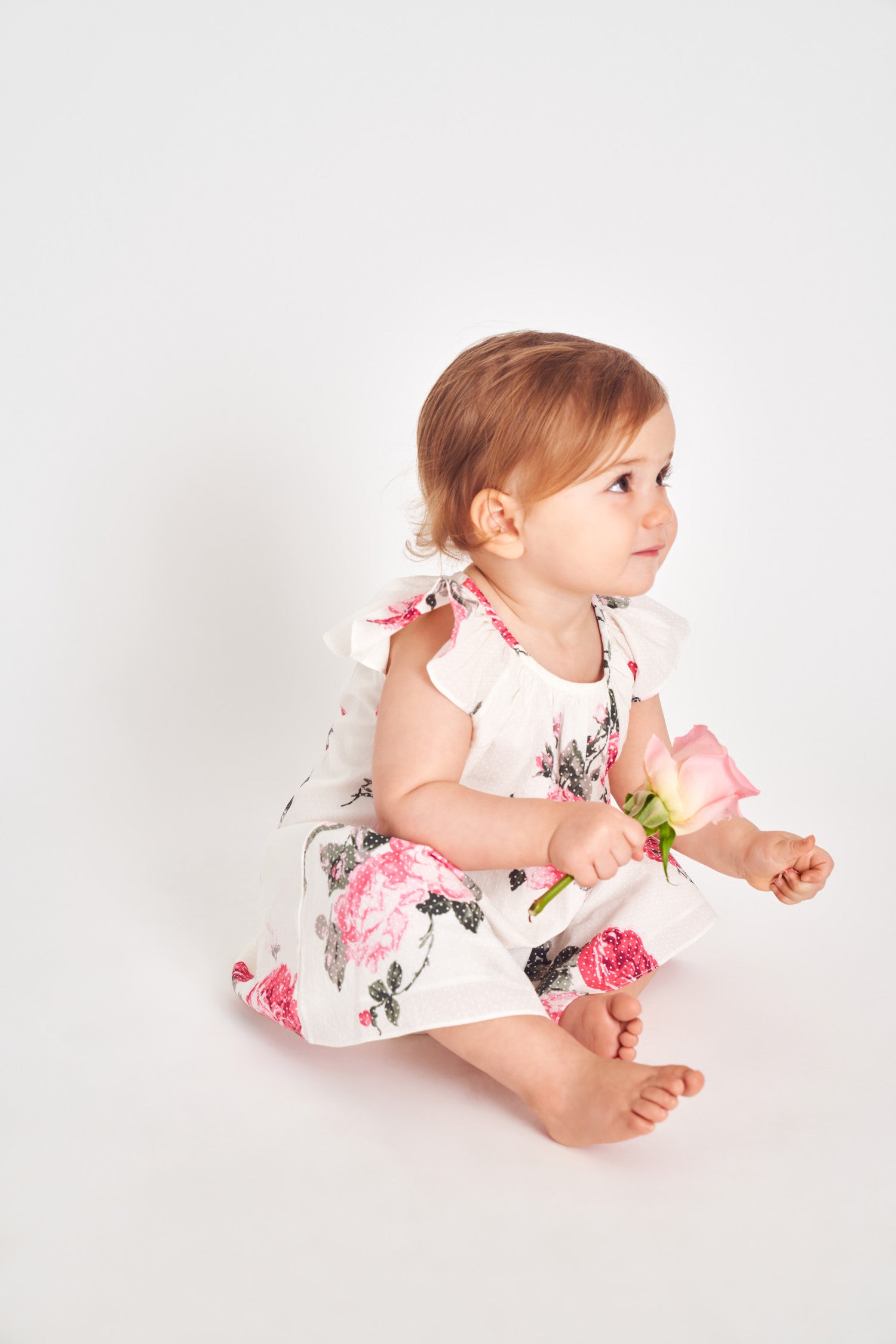 Circle neck floral print mini baby dress.