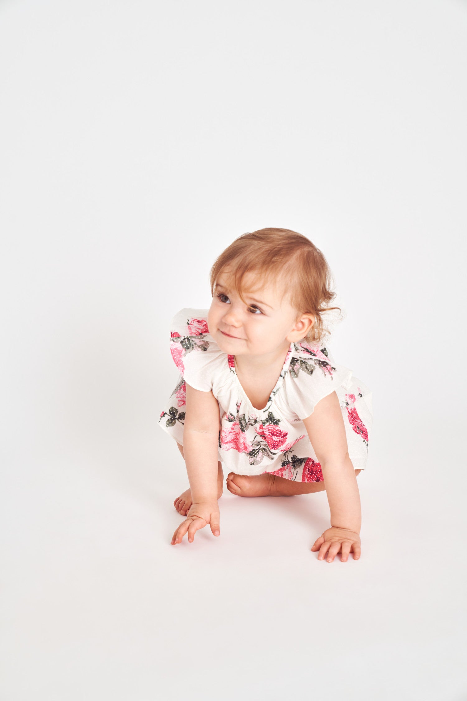 Circle neck floral print mini baby dress.