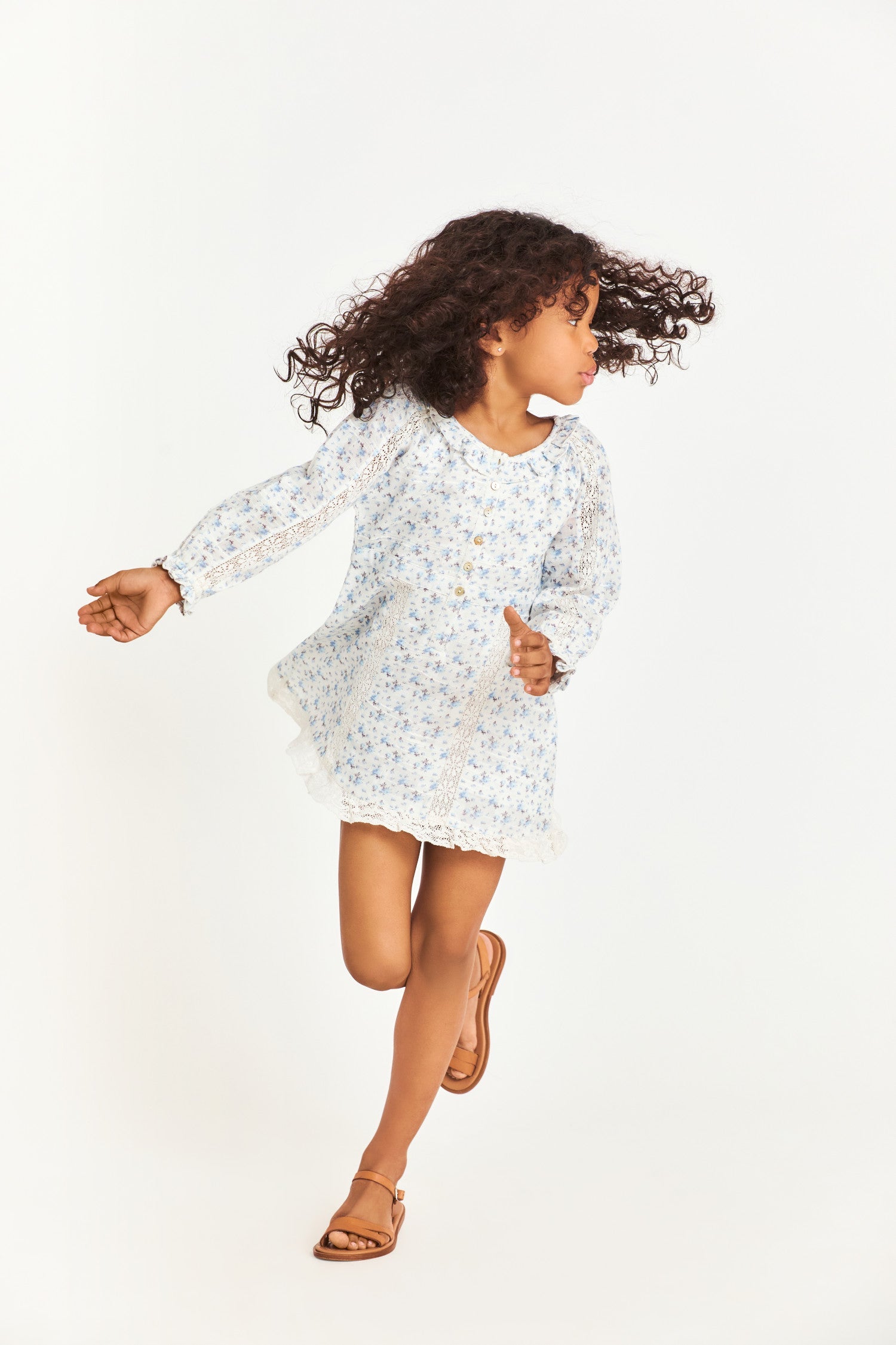 Model wearing kids blue long sleeve mini dress