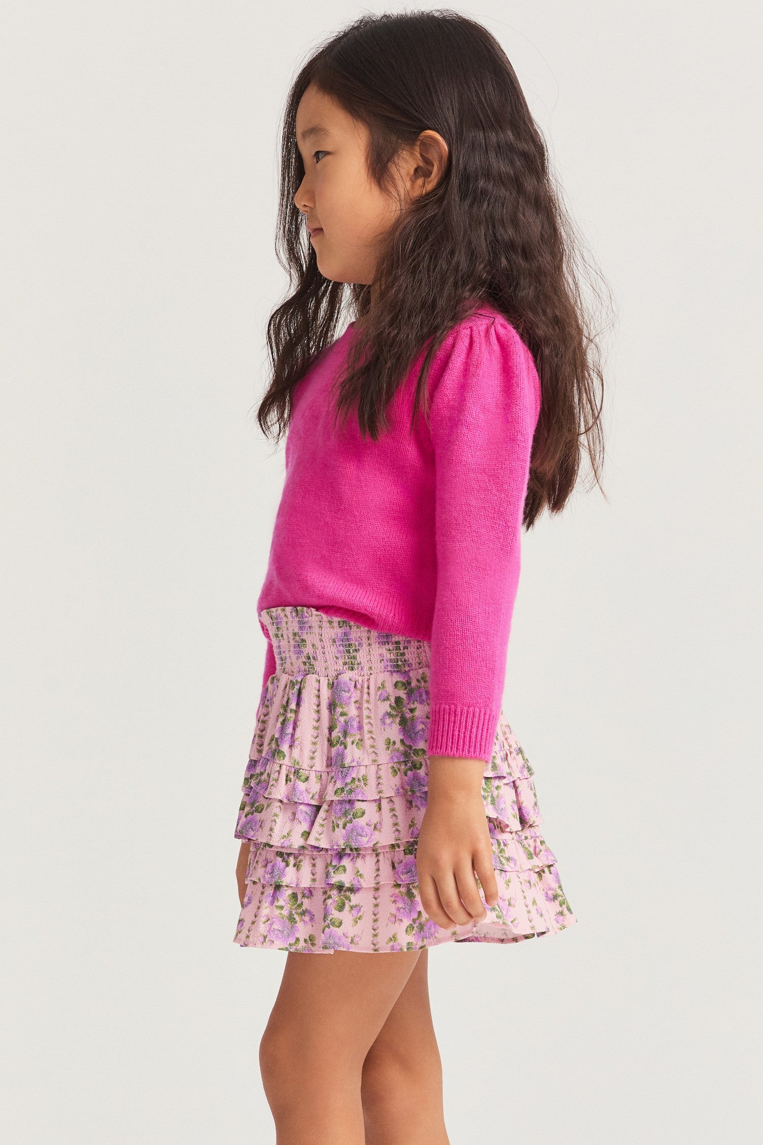 Little girls ruffle mini skirt in a pink flower print.