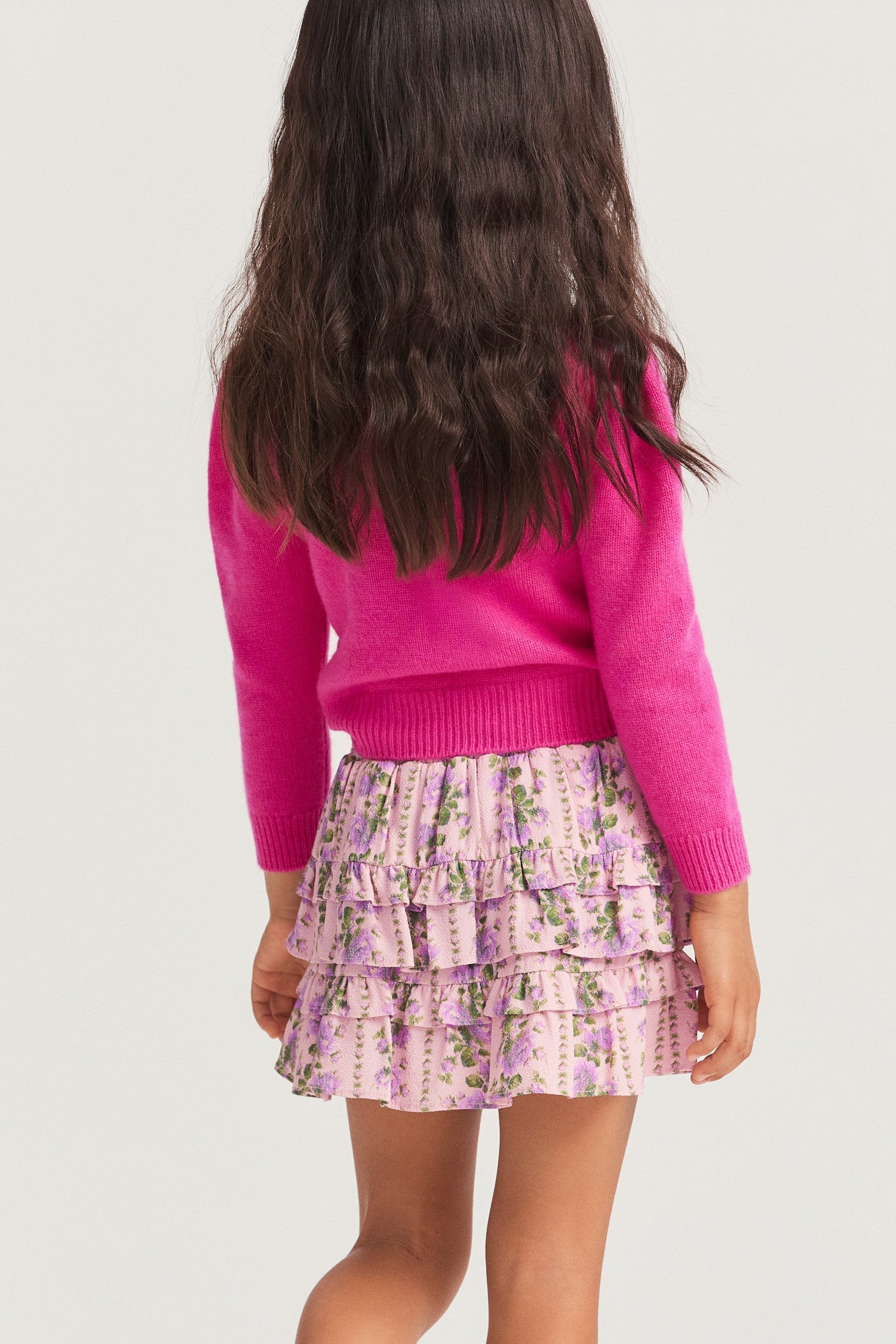 Little girls ruffle mini skirt in a pink flower print.