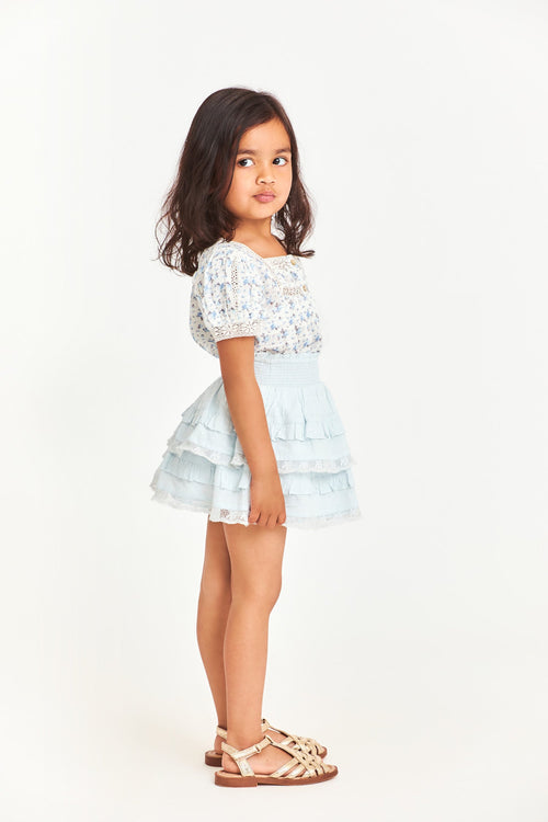 Side image of kids blue mini skirt