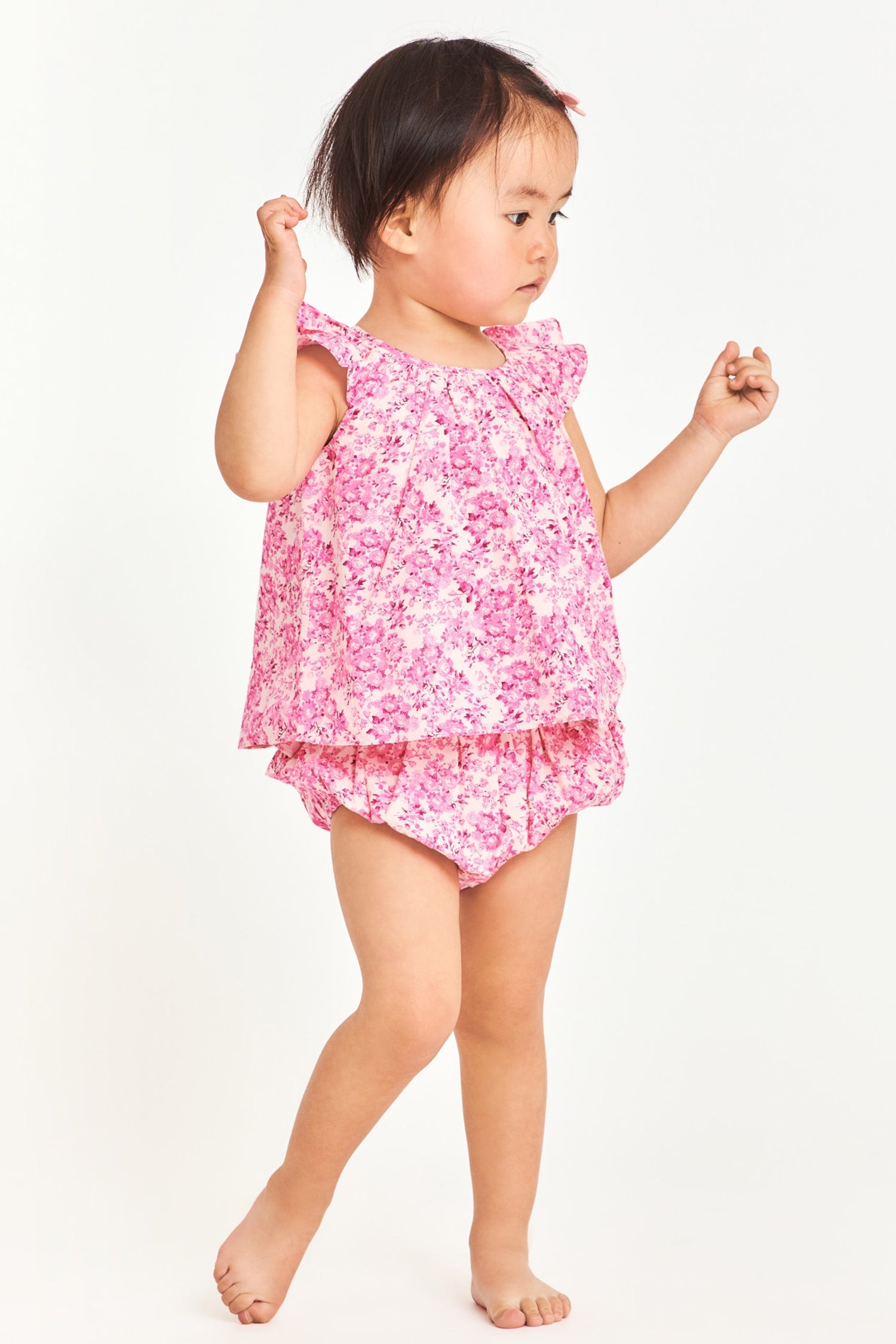 Pink floral baby top with ruffle sleeves