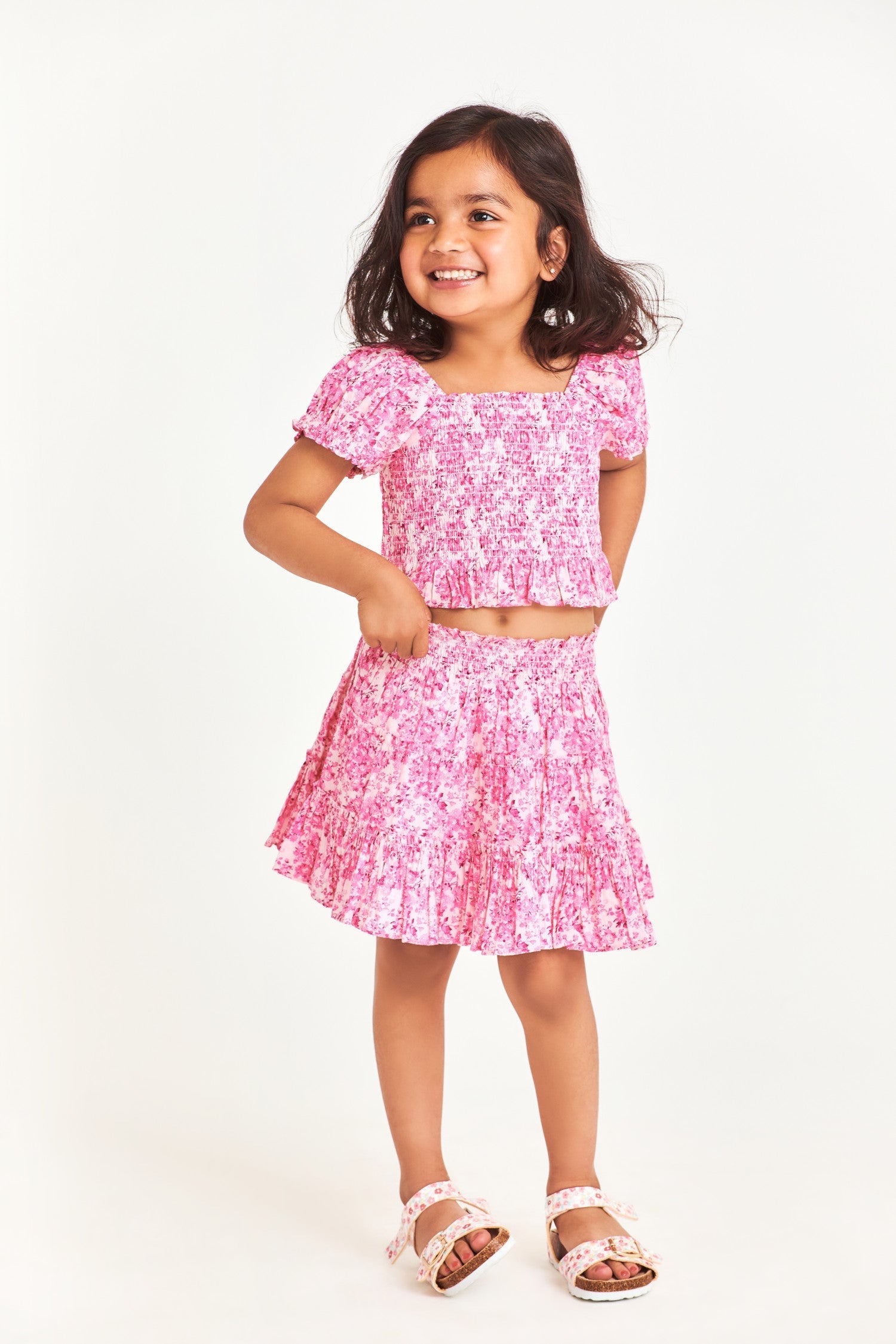 Pink smocked floral kids top with puff sleeves