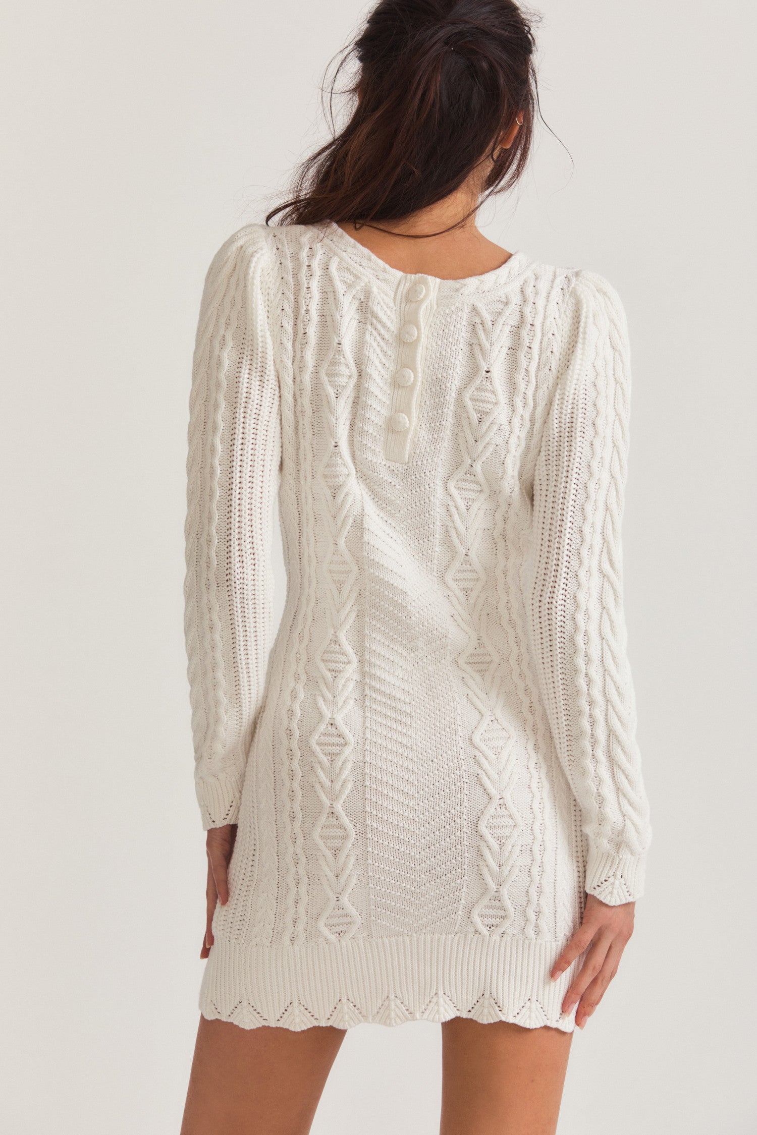 White long sleeved mini sweater dress with cord texture