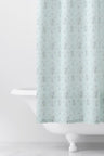 Designed from linen and cotton, its the perfect vintage-inspired shower curtain featuring a blue floral print across the back of a baby blue shower curtain. 