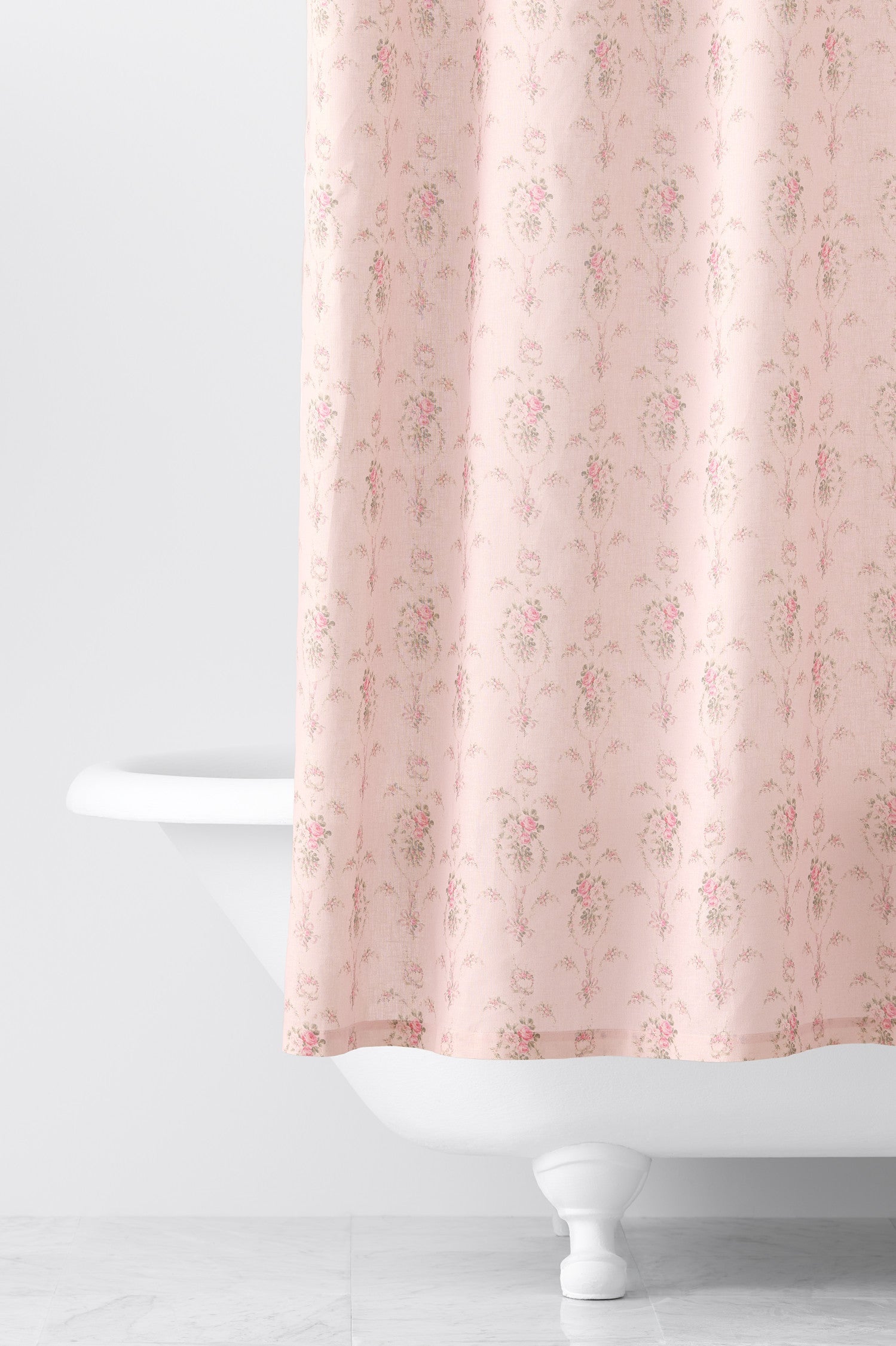 Designed from linen and cotton, its the perfect vintage-inspired shower curtain featuring a pink floral print across the back of a baby pink shower curtain. 