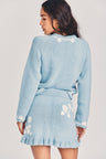 Women's blue wool mini skirt with hand-embroidered garden motif