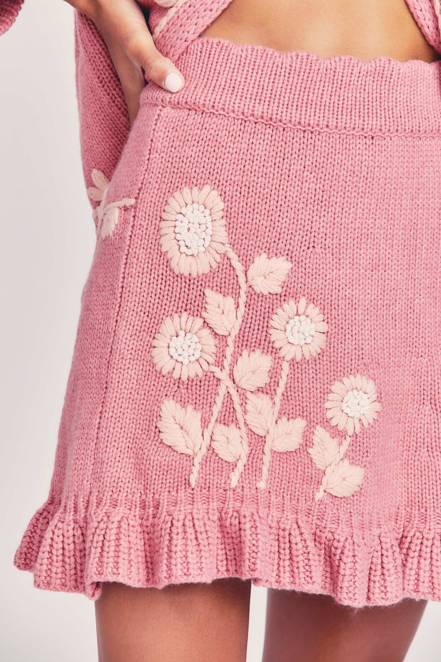 Women's pink wool mini skirt with hand-embroidered garden motif