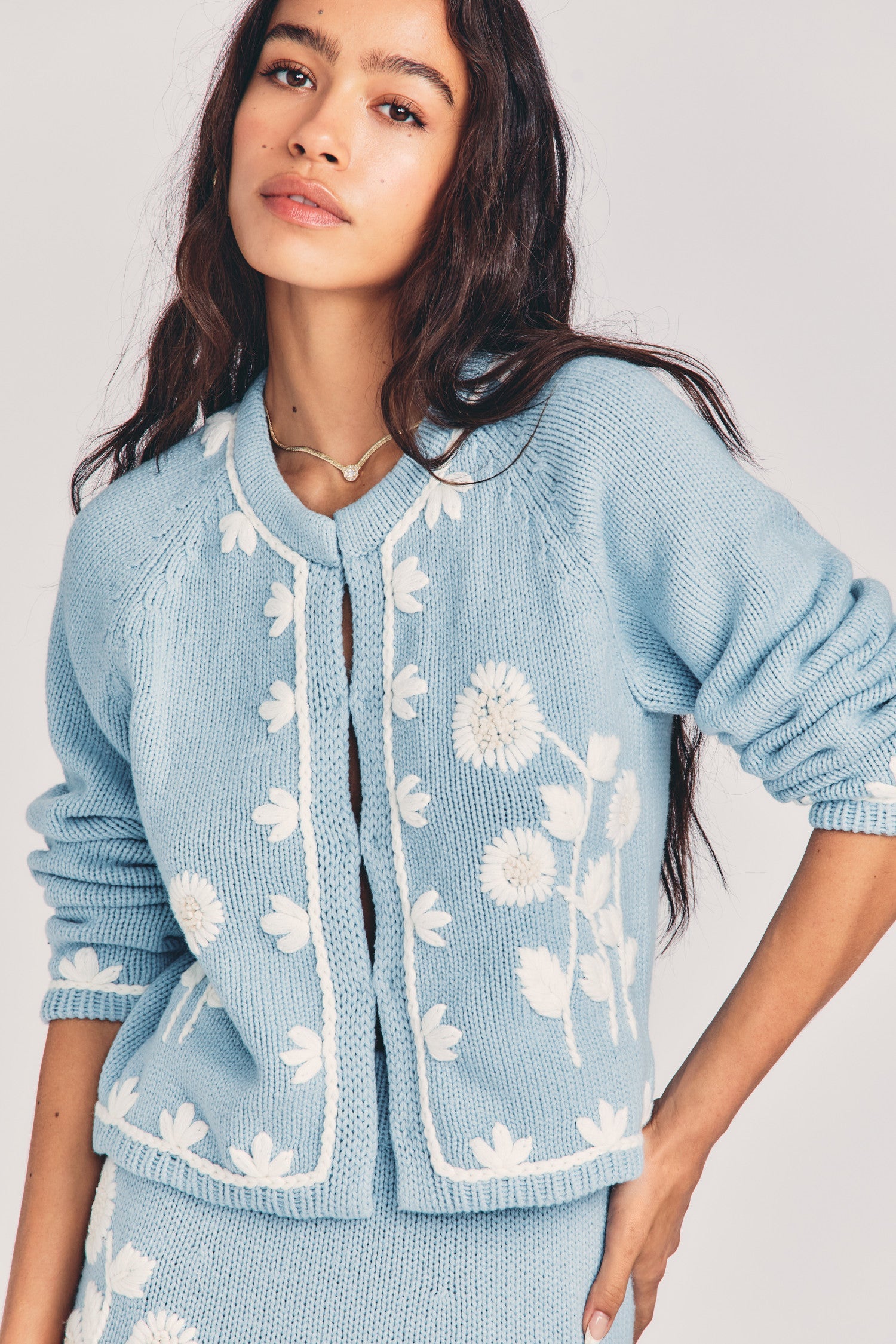 Women's blue cardigan with a hand-embroidered garden motif