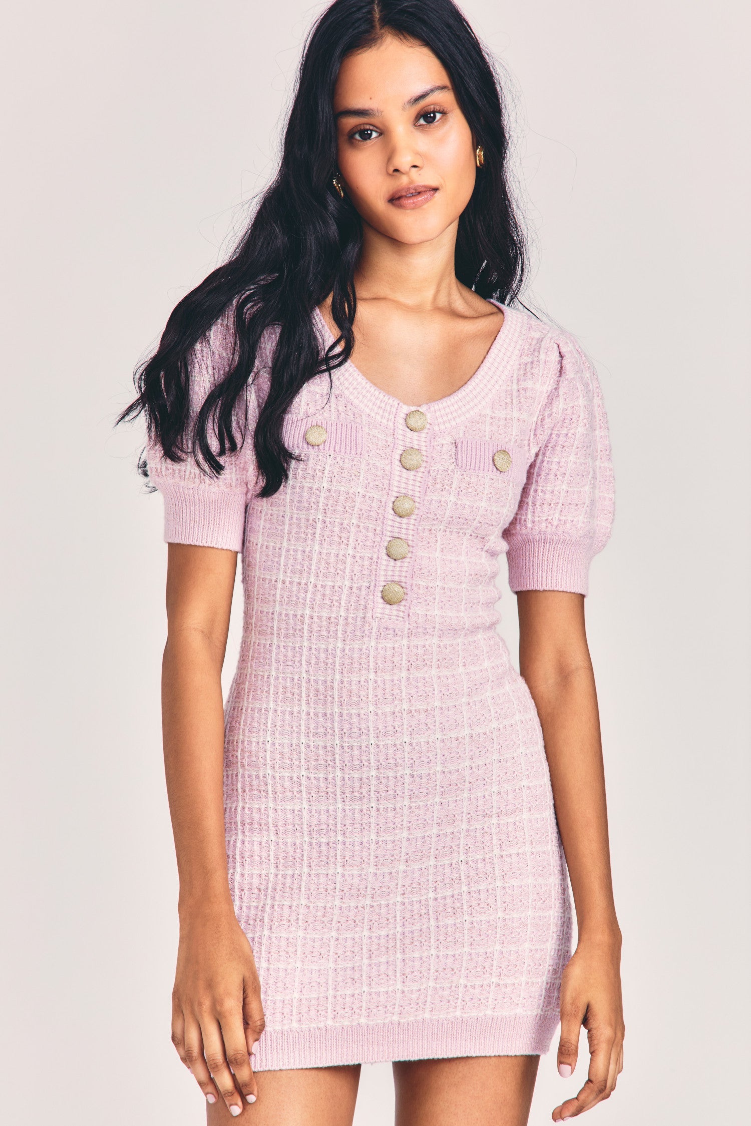 Womens light pink fitted scoop neck mini dress with gold buttons down front, breast pockets, and puffed sleeves