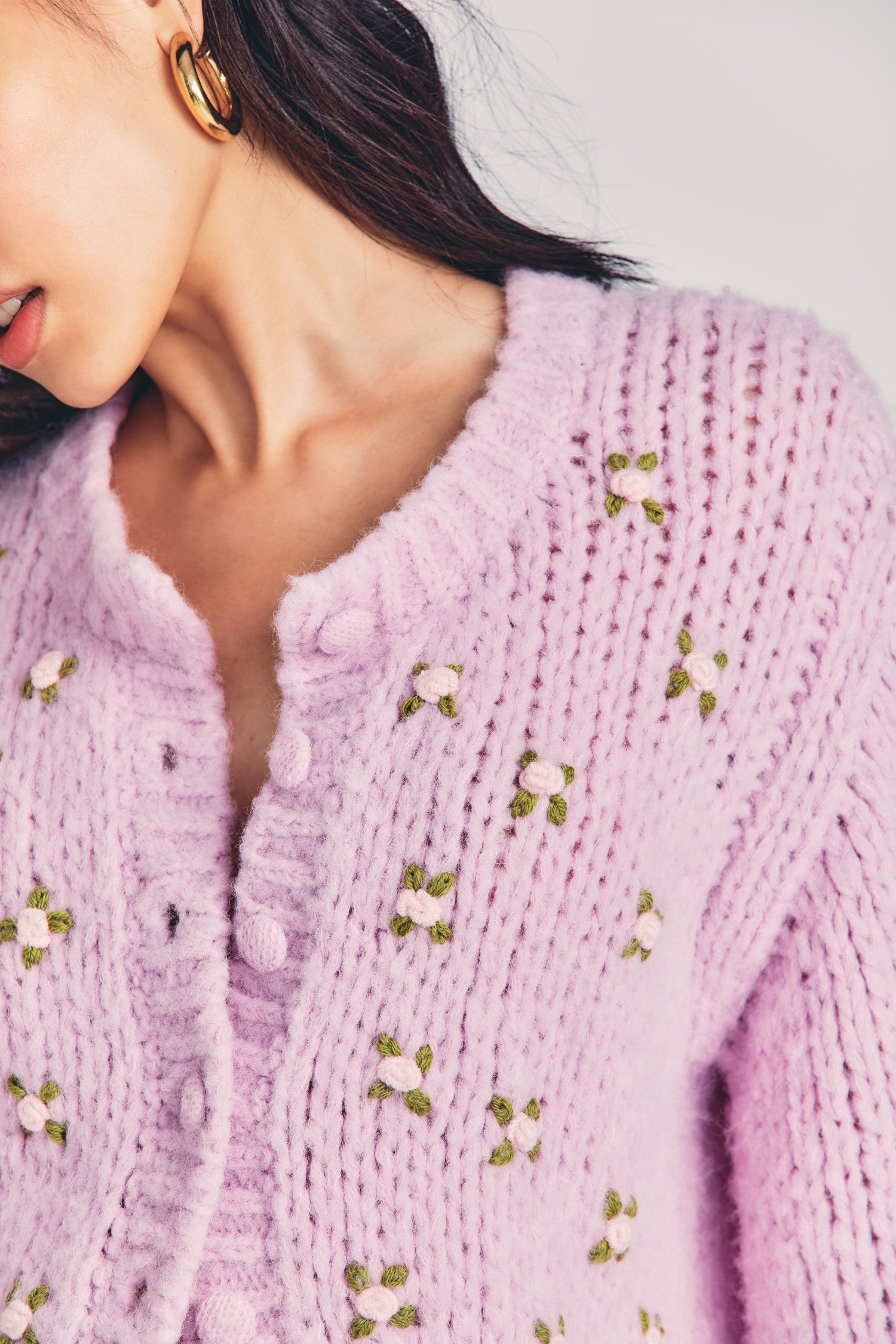 Women's pink chunky cardigan with sprinkled rosettes at front