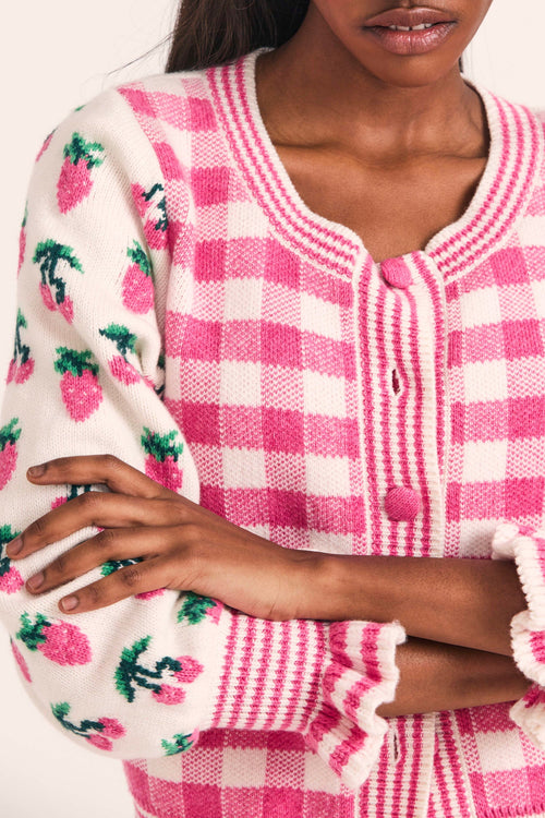 Women's button up sweater with check pattern and strawberry print sleeves