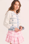 Womens white cardigan with blue bow, heart, and bouquet stitching
