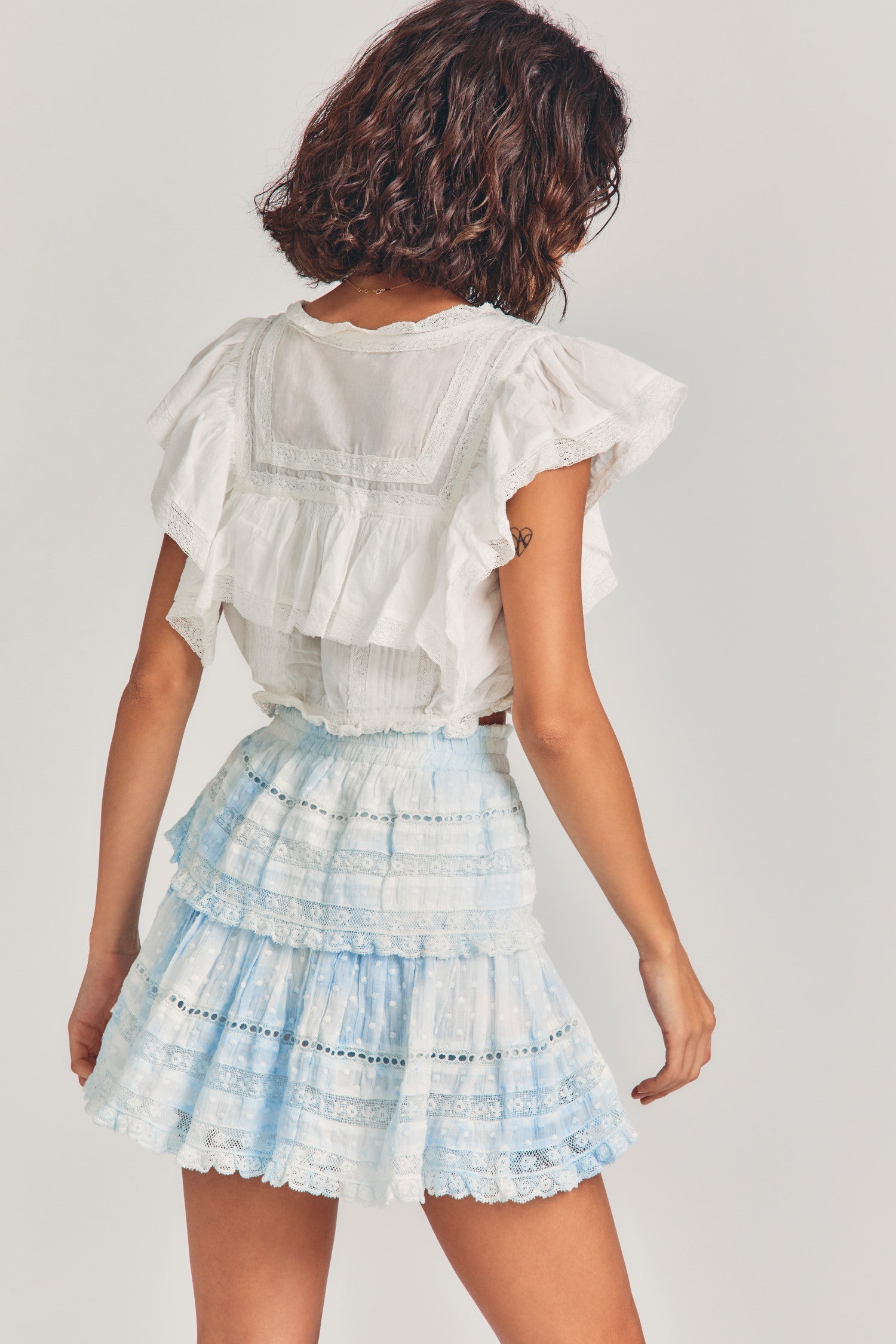 Light blue tie-dyed mini skirt with two tiers of ruffles