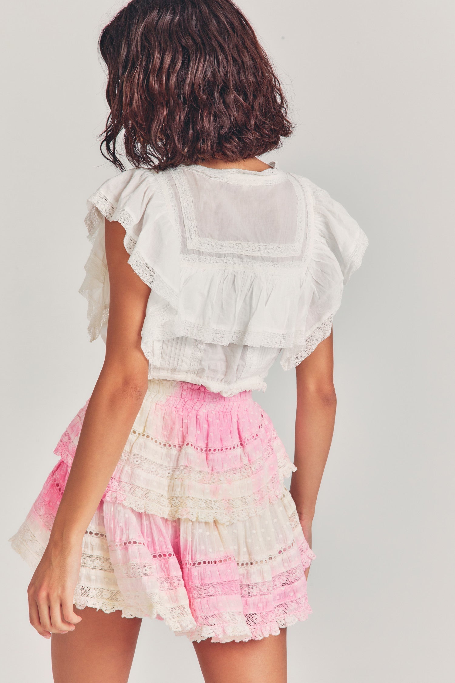 Pink tie-dyed mini skirt with two tiers of ruffles