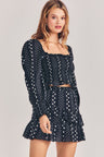 Womens black mini ruffle skirt with silver star and stripe detailing
