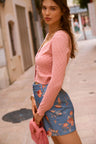 Women's blue corduroy denim mini skirt with carnation print