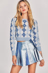 Shiny blue metallic mini skirt with a fixed waist and princess seam detailing