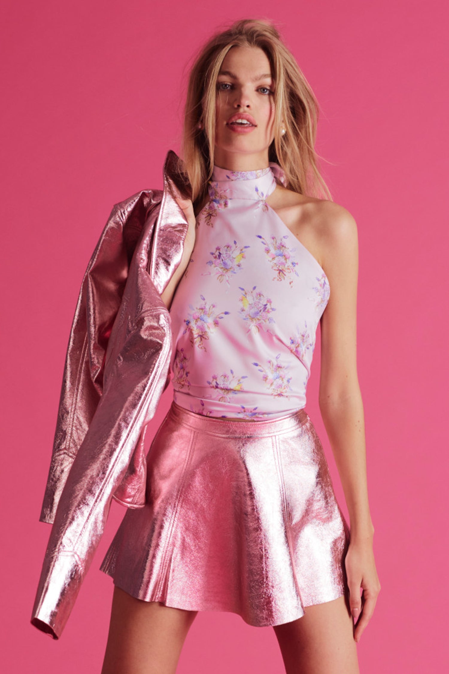 Shiny pink metallic mini skirt with a fixed waist and princess seam detailing