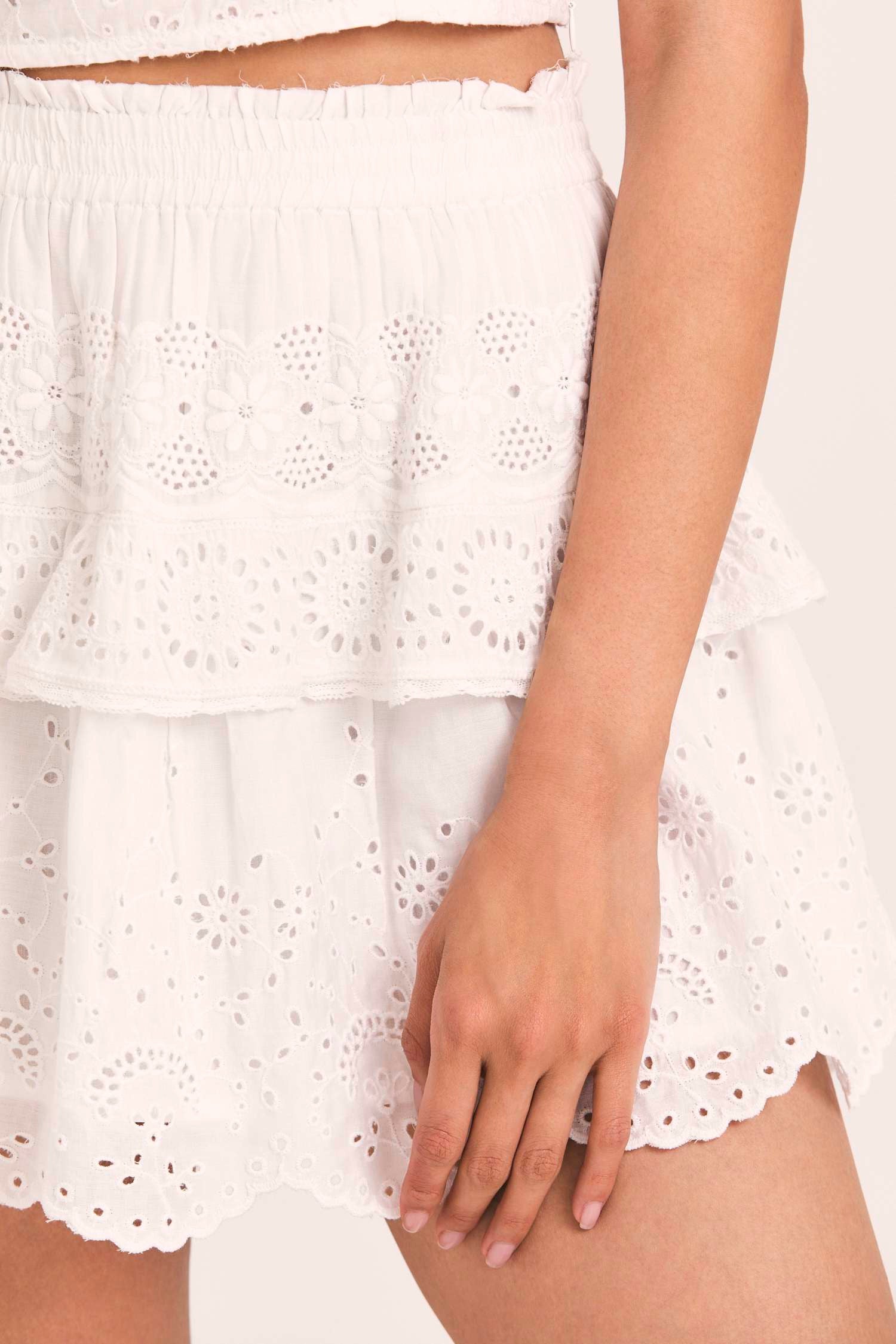 Women's white floral eyelet embroidered skirt with a short lace-trimmed flounce