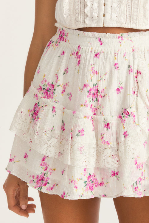 Womens ruffle mini skirt with magenta floral print and lace detail