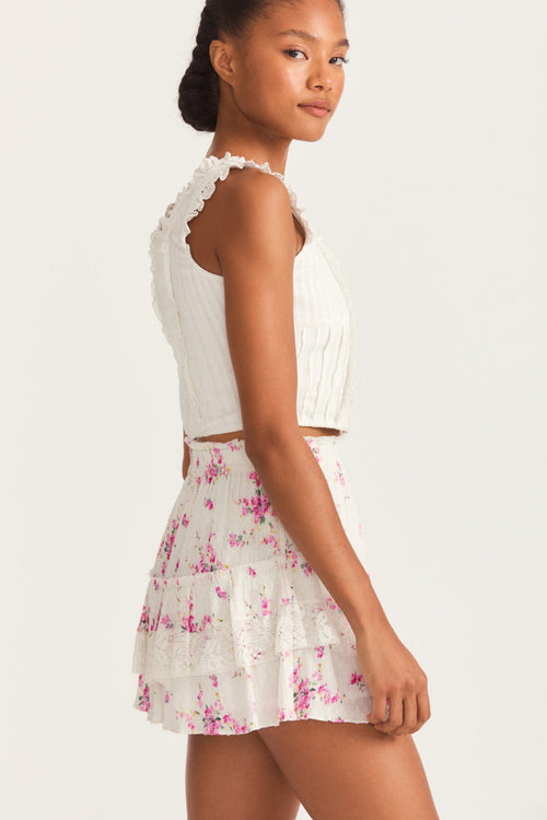 Womens ruffle mini skirt with magenta floral print and lace detail