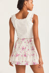 Womens ruffle mini skirt with magenta floral print and lace detail