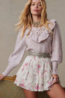 Womens ruffle mini skirt with magenta floral print and lace detail