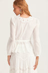 Womens white wrap top with custom embroidery detailing