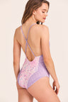 Womens purple and pink one piece bikini with v-neck in front and low back in a polka dot and floral print