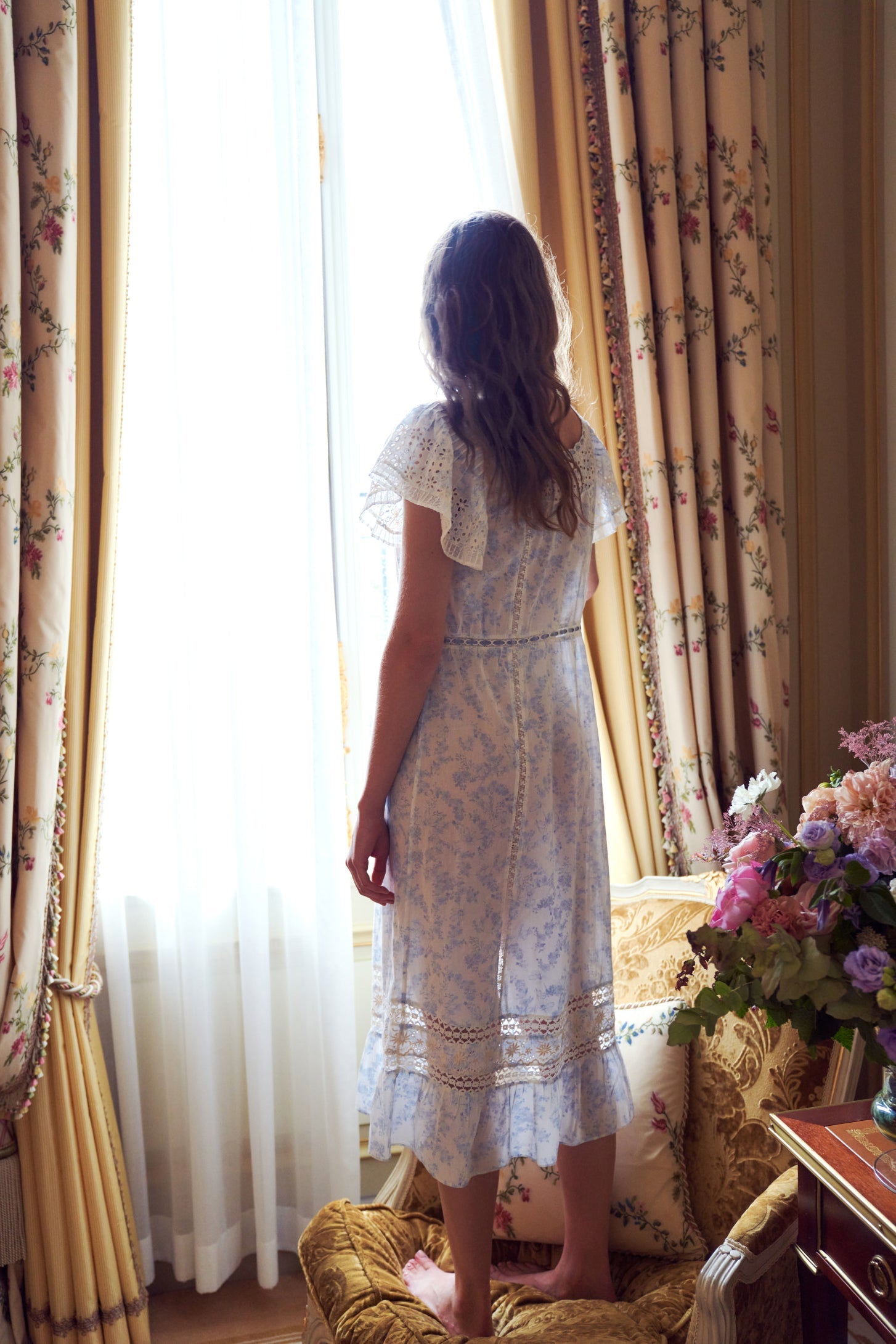 Womens light blue faded floral print midi dress with embroidery and lace detailing and ruffle sleeves