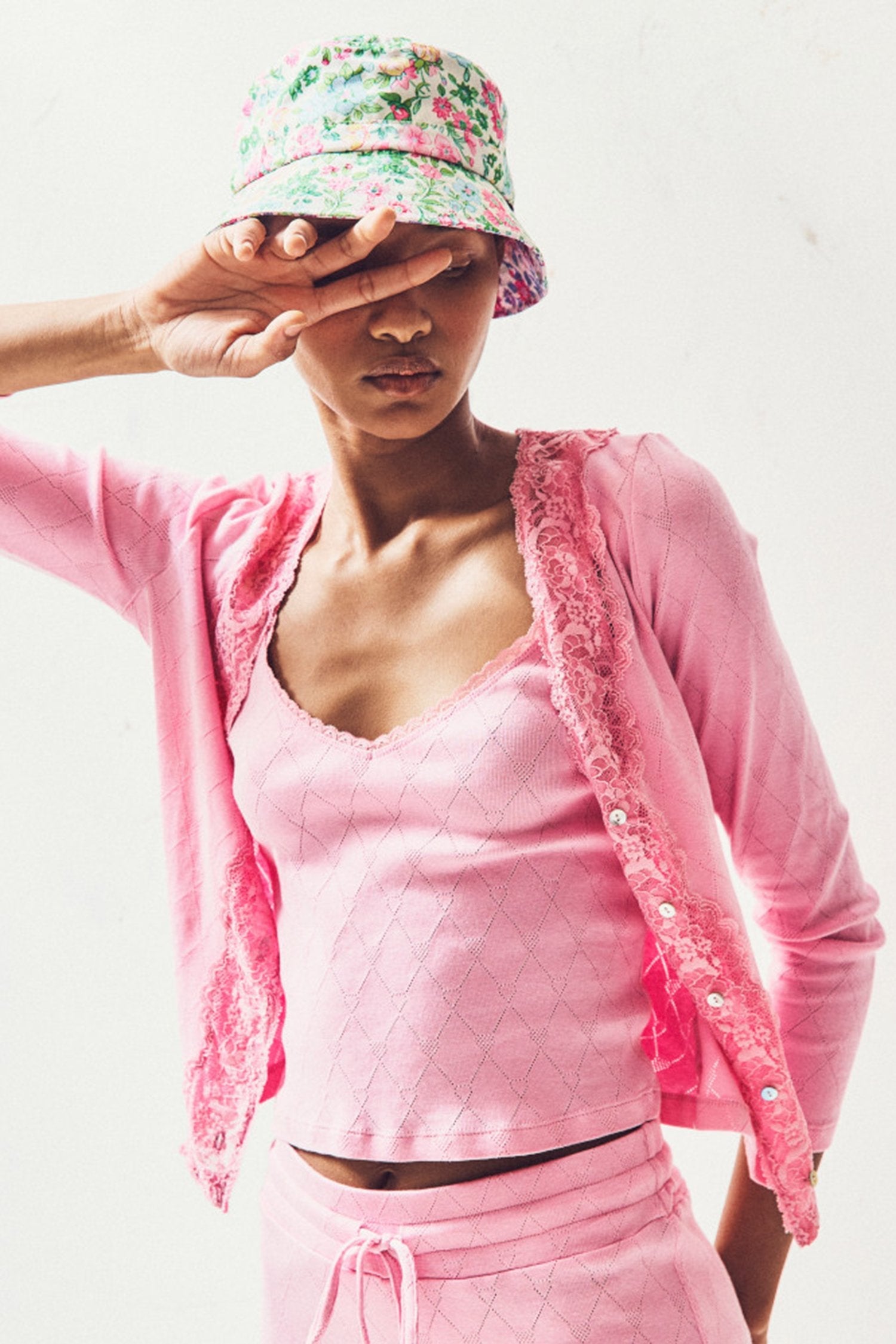 Women's pink cardigan with lace neckline