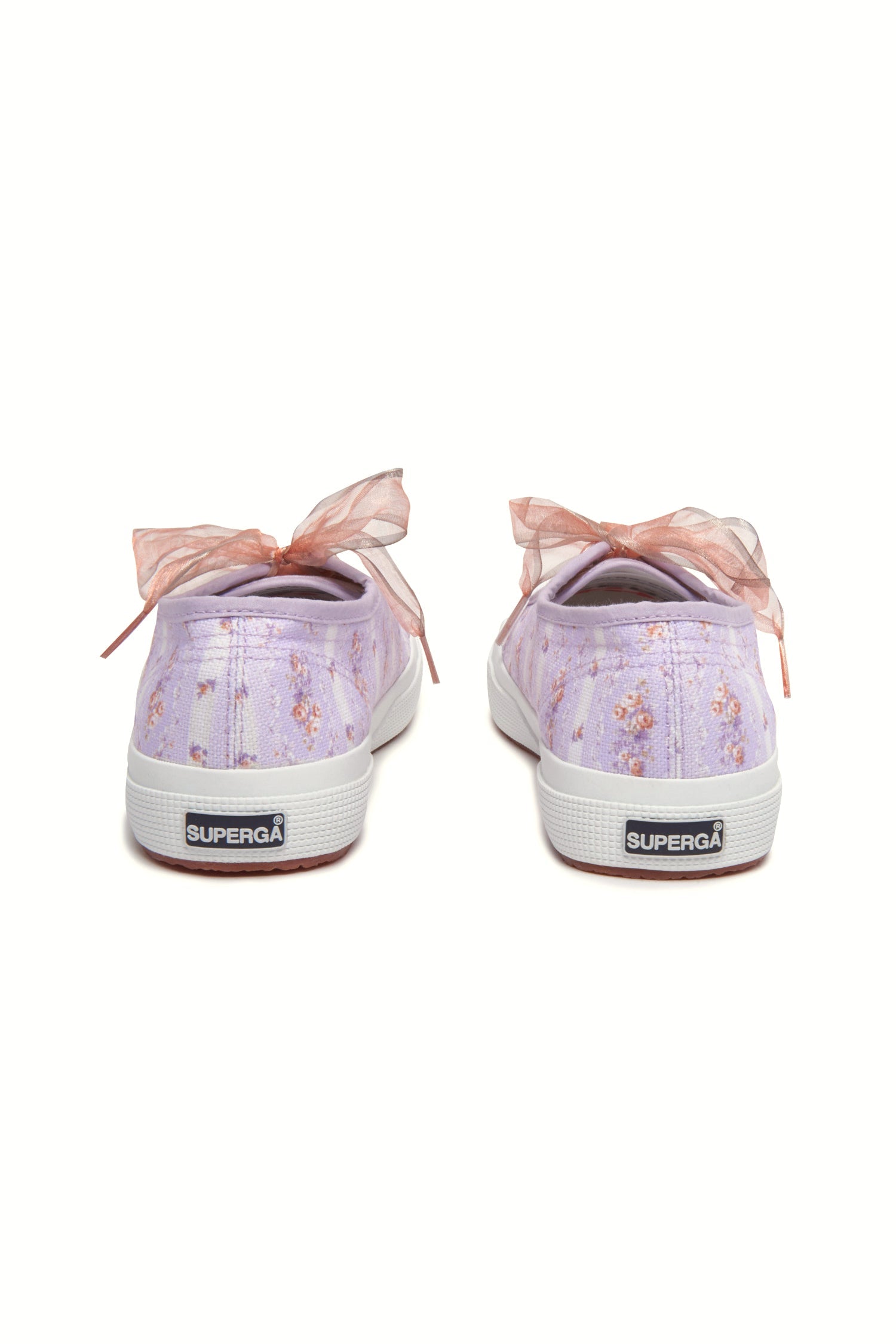 Pastel lilac sneaker with floral pattern on printed cotton, gold-toned eyelet details, and pink organza laces.